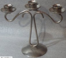 Блестящий подсвечник тройной